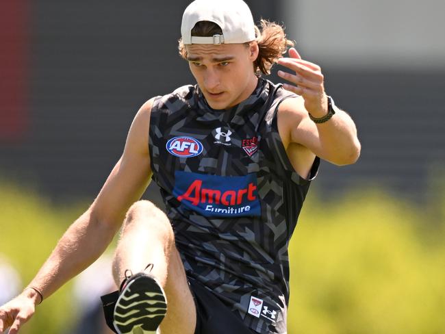 MELBOURNE, AUSTRALIA - FEBRUARY 14: Harrison Jones of the Bombers kicks the ball during an Essendon Bombers AFL training session at The Hangar on February 14, 2023 in Melbourne, Australia. (Photo by Morgan Hancock/Getty Images)
