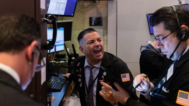 Traders deal with falls of 10 per cent on the floor of the New York Stock Exchange on Thursday Picture: AFP