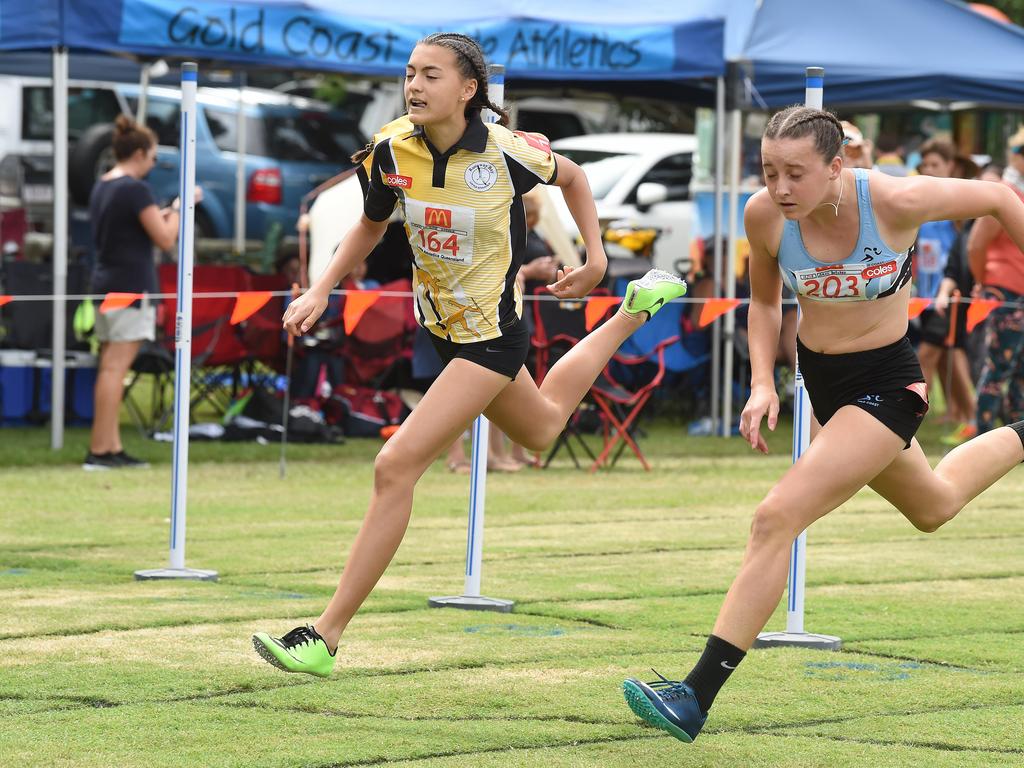 South Coast Little Athletics Titles at Pizzey Park in Miami. Girls 100 metre 14 yrs. Amali Butcher (on right) just beats Dior Scholz over the line. Picture: Lawrence Pinder