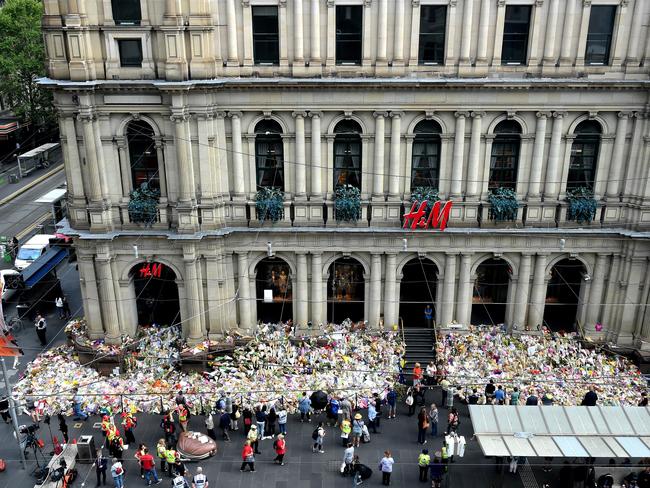 Bourke Street Memorial flowers being removed. Picture: Nicole Garmston