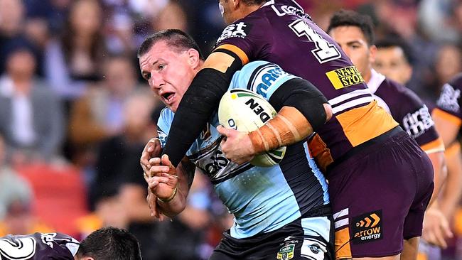 Paul Gallen is wrapped up by Adam Blair in his 300th.