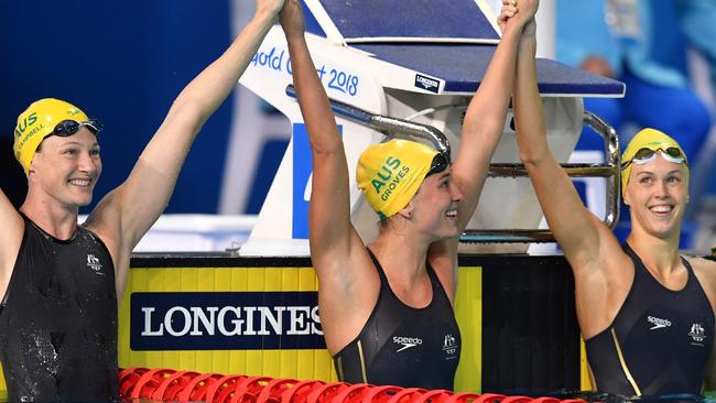 Cate Campbell, Madeline Groves and Holly Barratt celebrate a trifecta in the 50m butterfly.