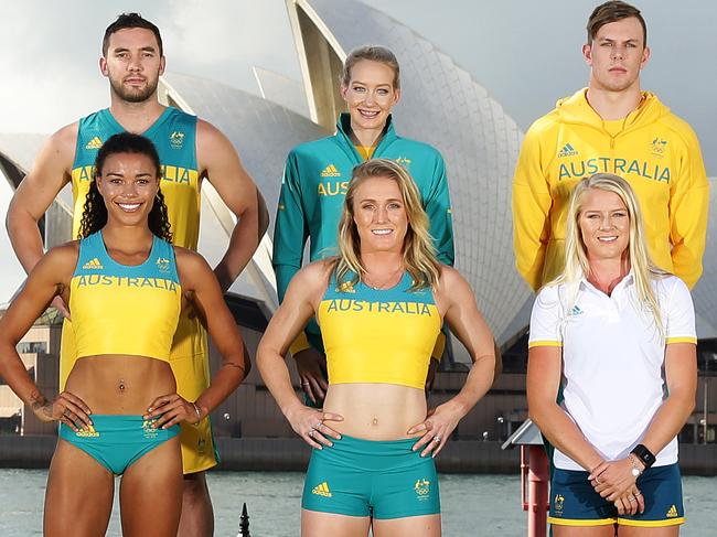 (Back L to R) Holly Lincoln-Smith, Adam Gibson, Madison Wilson, Kyle Chalmers, Stephanie Talbot, (Front L to R) Morgan Mitchell, Sally Pearson and Brooke Stratton unveil the official uniforms to be worn by the Australian Olympic team during the 2016 Rio Olympic Games in front of the Sydney Opera House. Pic Brett Costello