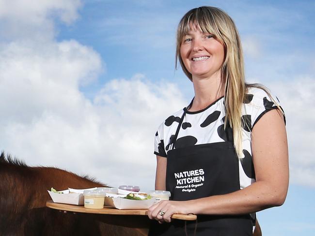 L-R Sarah Anderson of Tasmanian Fruit Pies at Sandfly, Tim Direen with Jen the Holstein cow of 2CowMilk of Cygnet, Sarra Gregg of Natural and Organic Delights of Peggys Beach. Launch of Taste of the Huon. Picture: NIKKI DAVIS-JONES