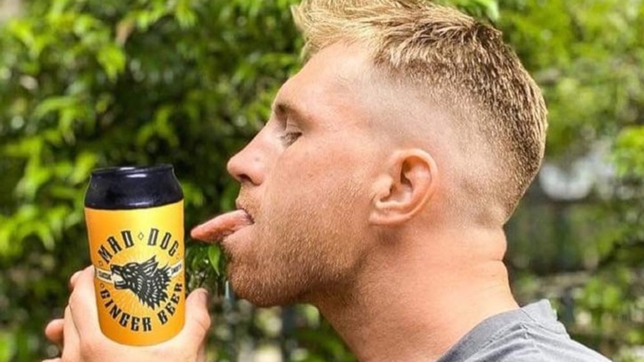 Cameron Munster spruiking his own alcoholic ginger beer, Mad Dog.