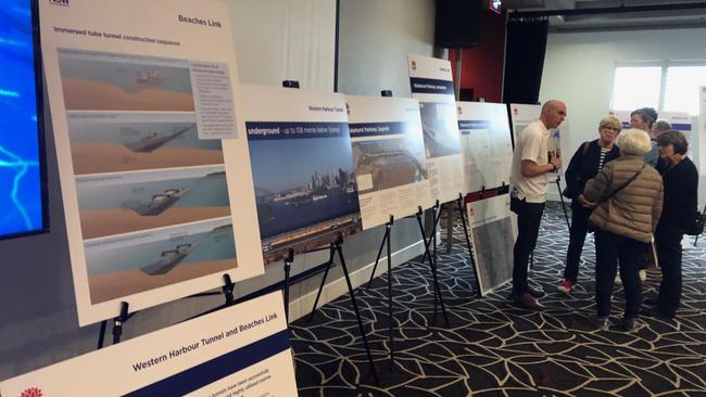 Residents speaking to NSW Government officials at a community feedback and information session, for the proposed Beaches Link tunnel, at the Manly-Warringah Leagues Club.