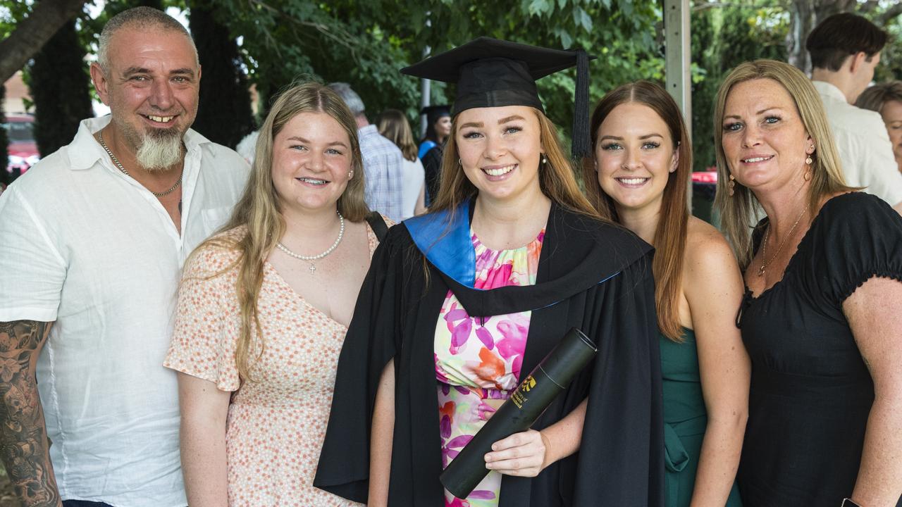 Bachelor of Nursing graduate Charlee Quinn with family (from left) Greg Harper, Bailee Quinn, Madi Quinn and Ricky Harper at a UniSQ graduation ceremony at Empire Theatres, Tuesday, February 13, 2024. Picture: Kevin Farmer