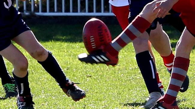 Increasing popularity of junior AFL on the North Shore. Under 11s AFL match between Mosman (red) and St Ives - generic action shots.Middle Head Oval, Mosman, NSW, Australia. 16 June 2018. (AAP Image/Annika Enderborg)