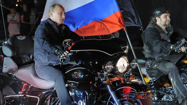 Vladimir Putin rides a motorbike in a 2011 festival held by the Night Wolves’ youth organisation in the southern Russian town of Novorossiysk. Picture: AFP