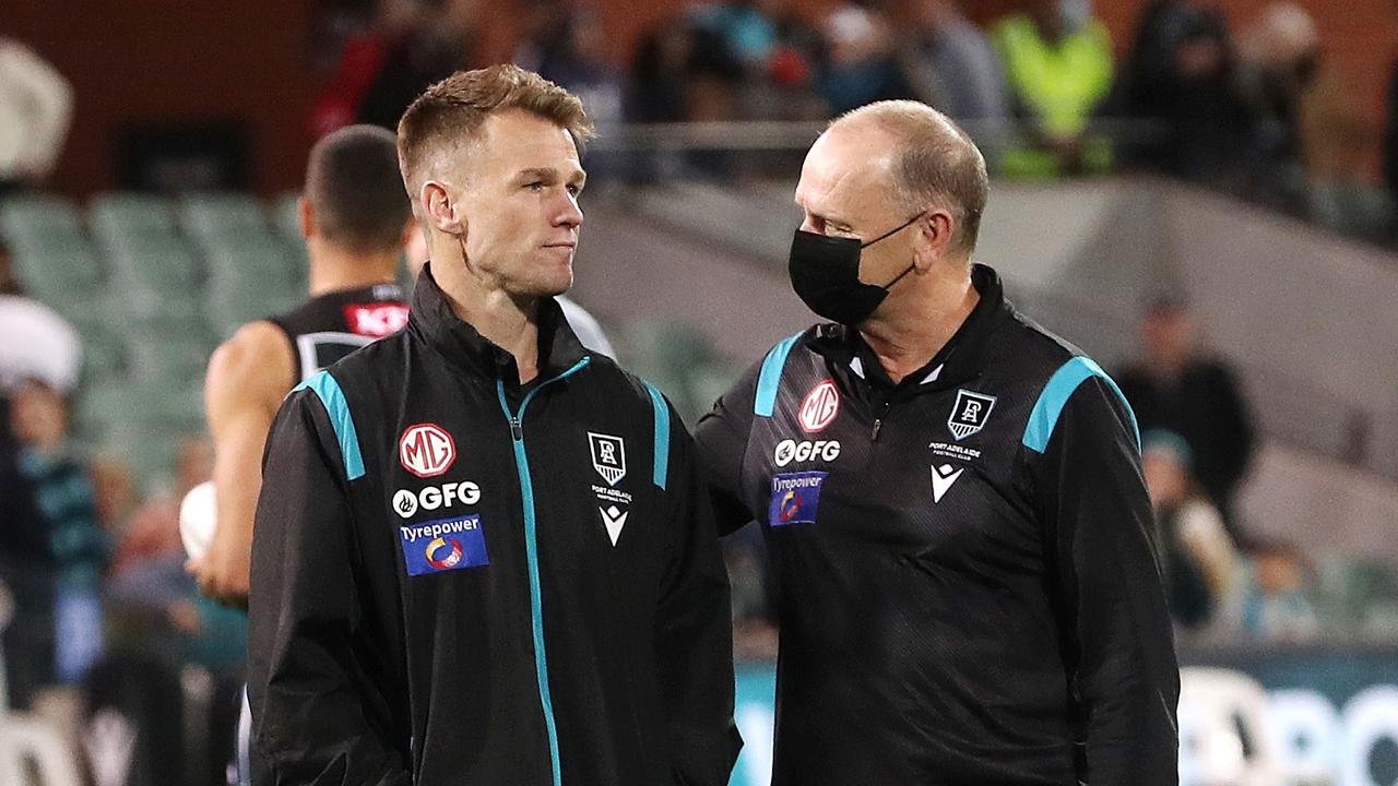 Robbie Gray chats with Port Adelaide coach Ken Hinkley. Picture: Sarah Reed/AFL Photos via Getty Images
