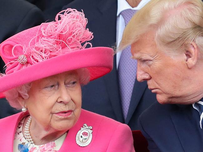 (FILES) In this file photo taken on June 5, 2019 Britain's Queen Elizabeth II (L) reacts as she sits with US President Donald Trump an event to commemorate the 75th anniversary of the D-Day landings, in Portsmouth, southern England. - Queen Elizabeth II, the longest-serving monarch in British history and an icon instantly recognisable to billions of people around the world, has died aged 96, Buckingham Palace said on September 8, 2022. Her eldest son, Charles, 73, succeeds as king immediately, according to centuries of protocol, beginning a new, less certain chapter for the royal family after the queen's record-breaking 70-year reign. (Photo by Chris Jackson / POOL / AFP)