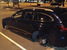 A staff member at Harbour Town Shopping Centre returned to find all four wheels and tyres stripped from her brand new car in the Biggera Waters car park.