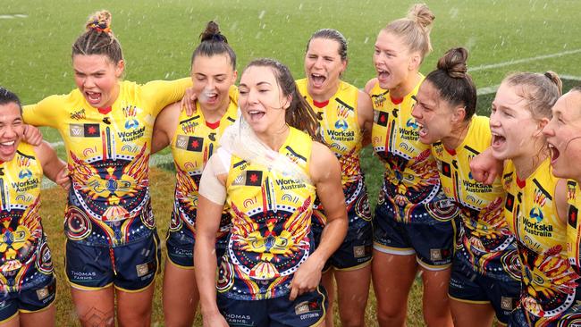 Adelaide players sing the team song after victory. Picture: Jonathan DiMaggio/AFL Photos/via Getty Images)