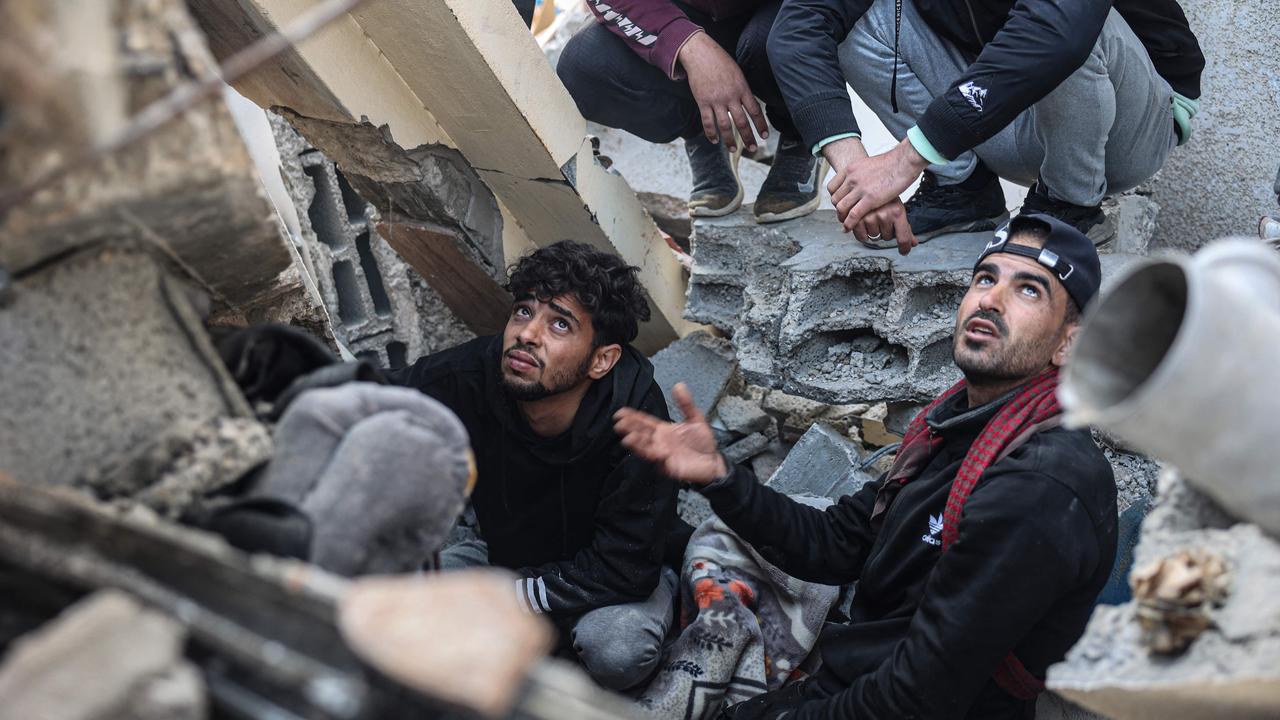 Palestinians search the rubble of their house destroyed in an overnight Israeli air strike in east Khan Yunis in the southern Gaza Strip. Picture: AFP