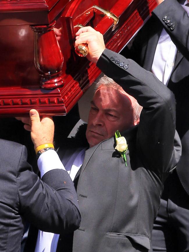 Borce carries the coffin of Karen Ristevski from the church after the funeral.