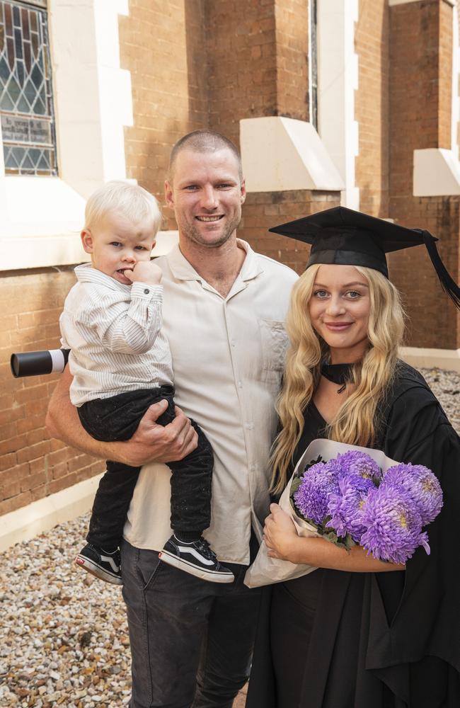 Bachelor of Paramedicine graduate Rachel Mackney with Louis Cartmill holding Oliver Cartmill at a UniSQ graduation ceremony at The Empire, Tuesday, June 25, 2024. Picture: Kevin Farmer