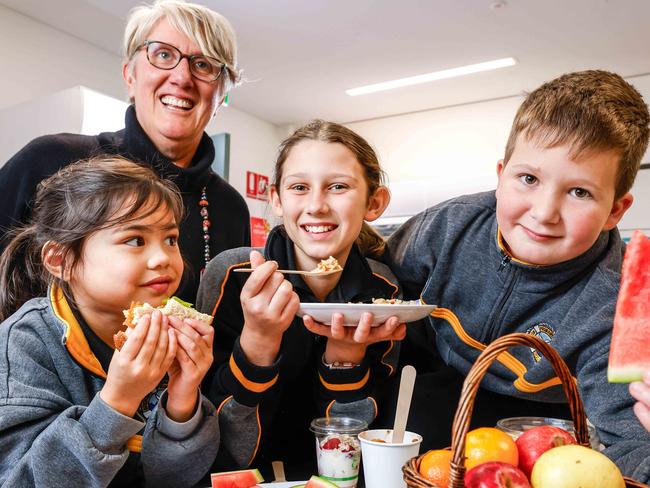 DPCHealthy Foods at SchoolStudents  Mila Cayetano 5, Carter McNeil 9 and Maddie Winker 11 with Rebecca Read- Principal in the canteen at Brighton Primary School  Image/Russell Millard