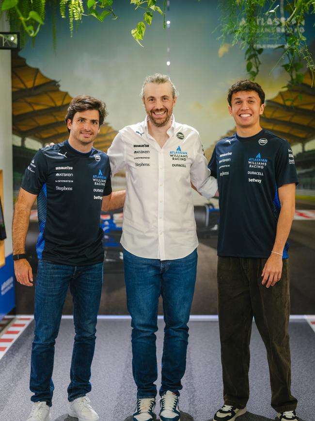 Atlassian CEO Mike Cannon-Brookes with Williams drivers Carlos Sainz and Alex Albon.