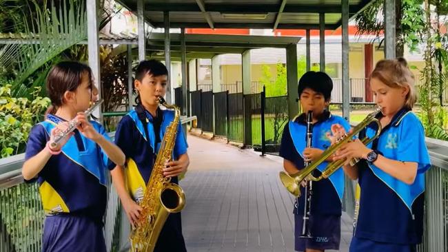 Tully State School has celebrated the town's centenary with a new song 'Tumblin' Tully Rain' co-created by students Queensland country musician Josh Arnold.