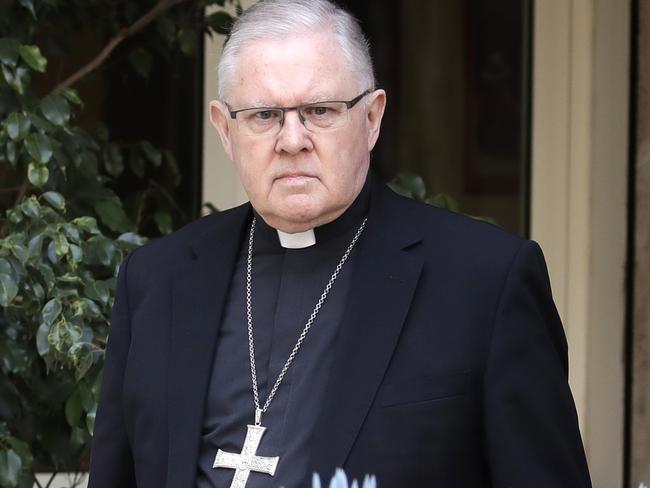 Brisbane's Archbishop Mark Coleridge arrives to reads a statement to the media on the conviction of Australian Cardinal George Pell for molesting two choir boys in the 1970s, in Rome, Tuesday, Feb. 26, 2019. The most senior Catholic cleric ever charged with child sex abuse has been convicted of molesting two choirboys moments after celebrating Mass, dealing a new blow to the Catholic hierarchy's credibility after a year of global revelations of abuse and cover-up.(AP Photo/Alessandra Tarantino)