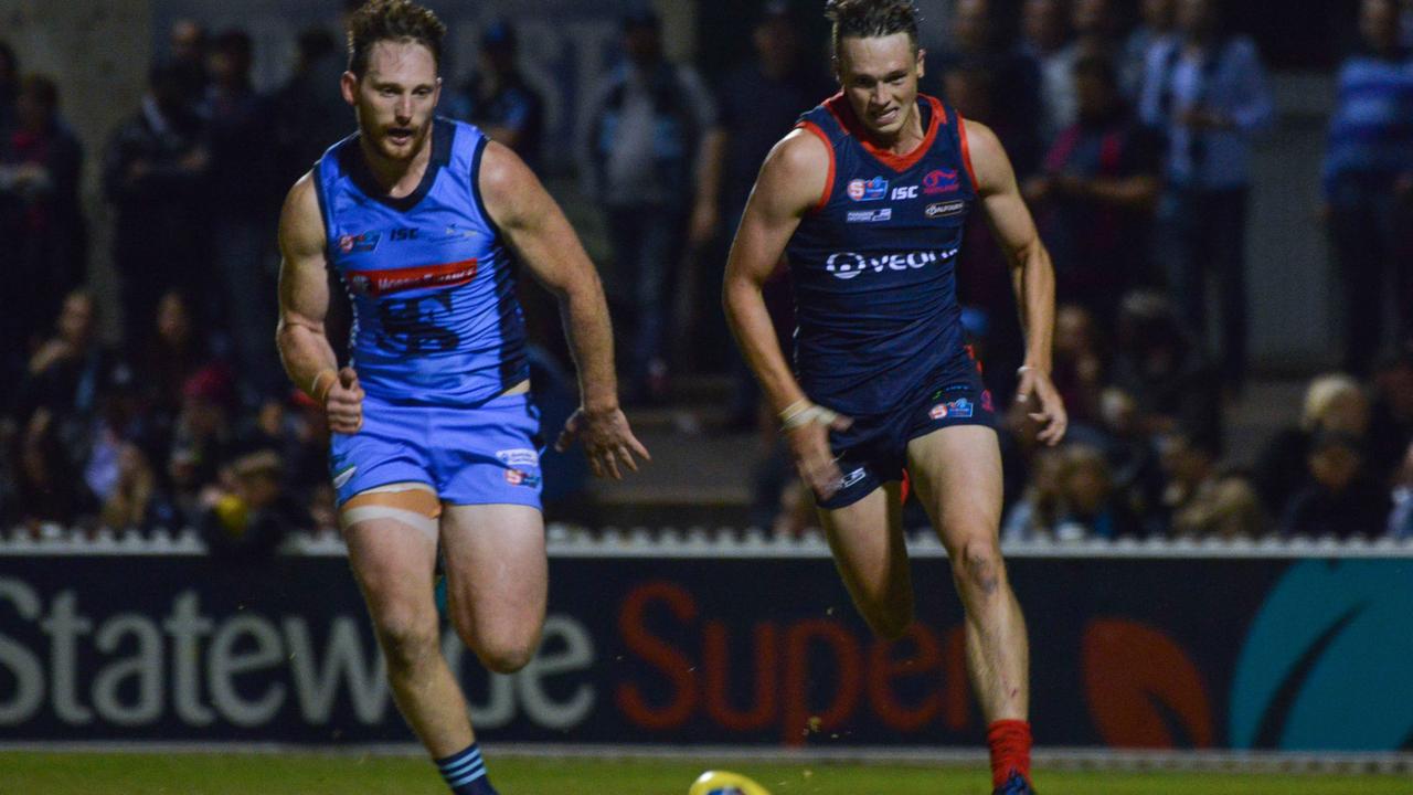 SANFL: Norwood v Sturt at Norwood Oval, Friday, April 12, 2019. Sturt's Aidan Riley beats Norwood's Tom Forster to the ball. (AAP Image/Brenton Edwards),