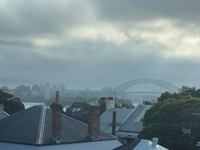 A cloud covered Sydney Harbour Bridge looking across houses from Balmain. #SnapSydney 2018. Picture: Billy Cantwell