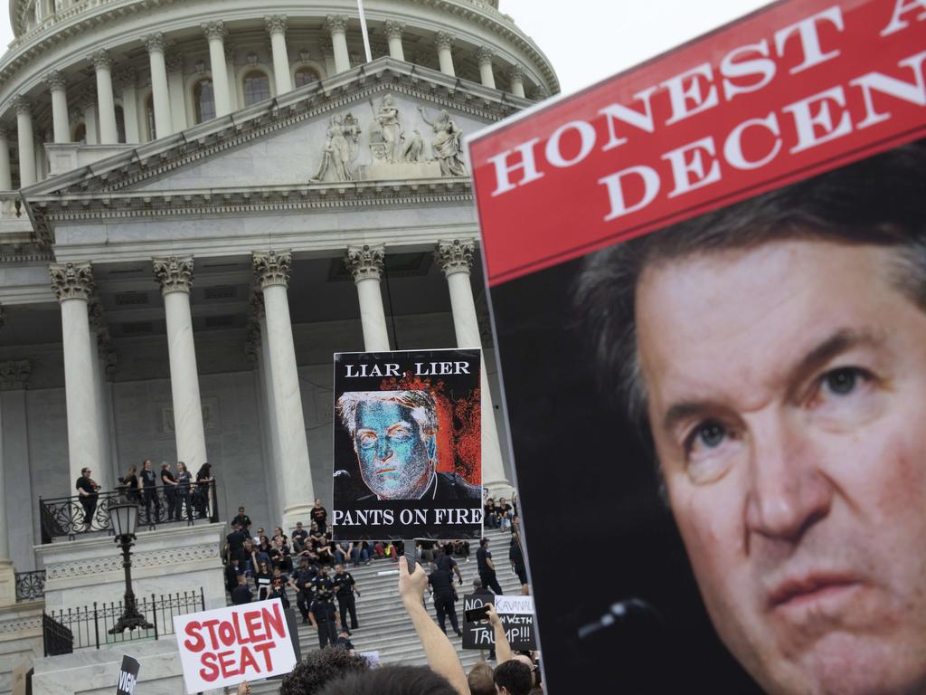 WASHINGTON, DC — OCTOBER 6: Protesters occupy the steps on the East Front of the U.S. Capitol in protest of Supreme Court nominee Judge Brett Kavanaugh, October 6, 2018 in Washington, DC. Hundreds were arrested by Capitol Police during the demonstration. The Senate is set to hold a final vote Saturday evening to confirm the nomination of Judge Brett Kavanaugh to the U.S. Supreme Court. Drew Angerer/Getty Images/AFP