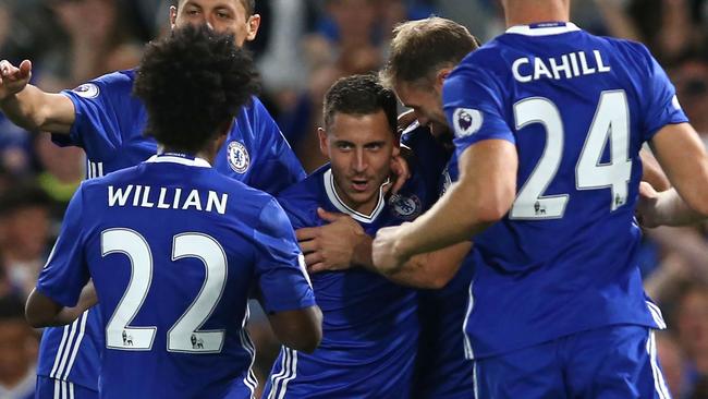 Chelsea's Belgian midfielder Eden Hazard celebrates with teammates.