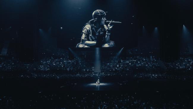 Billie Eilish sat cross-legged at centre stage in Brisbane. Picture: Henry Wu