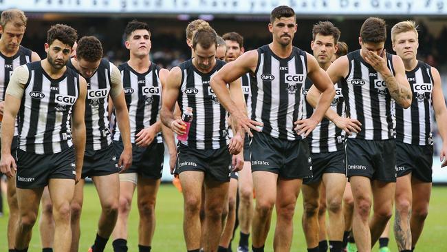 Scott Pendlebury leads Collingwood off the MCG.