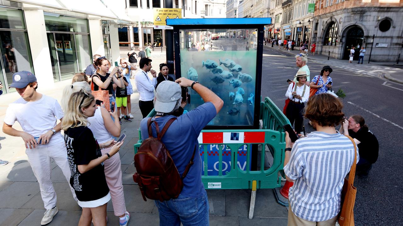 The artwork has attracted quite a crowd. Picture: Ryan Hiscott/Getty Images