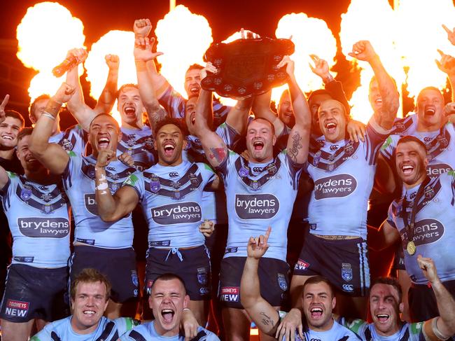 SYDNEY, AUSTRALIA - JULY 10: Boyd Cordner of the Blues and team mates celebrate with the State of Origin trophy after winning the series and winning game three of the 2019 State of Origin series between the New South Wales Blues and the Queensland Maroons at ANZ Stadium on July 10, 2019 in Sydney, Australia. (Photo by Cameron Spencer/Getty Images)