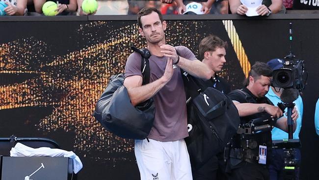 Andy Murray acknowledges the fans after losing his round one match against Tomas Martin Etcheverry. (Photo by Kelly Defina/Getty Images)