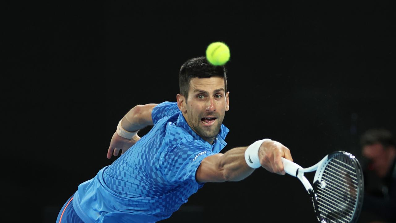 MELBOURNE, AUSTRALIA - JANUARY 29: Novak Djokovic of Serbia plays a backhand as he returns a serve in the Men's Singles Final match against Stefanos Tsitsipas of Greece during day 14 of the 2023 Australian Open at Melbourne Park on January 29, 2023 in Melbourne, Australia. (Photo by Clive Brunskill/Getty Images) *** BESTPIX ***