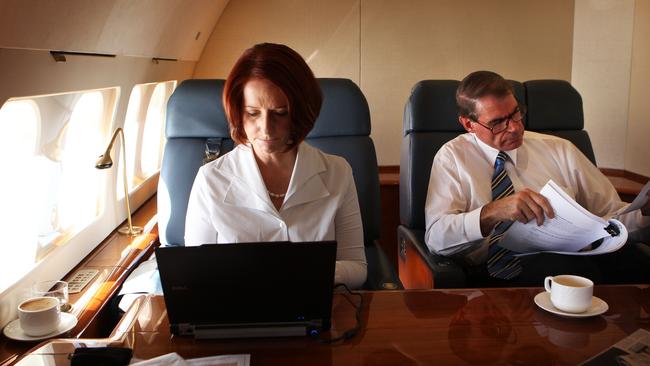 Australia’s first female prime minister, Julia Gillard, works on the RAAF VIP jet with Senator John Faulkner. Picture: File