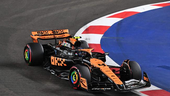 McLaren's British driver Lando Norris drives during the qualifying session of the Singapore Formula One Grand Prix night race at the Marina Bay Street Circuit in Singapore on September 16, 2023. (Photo by ROSLAN RAHMAN / AFP)