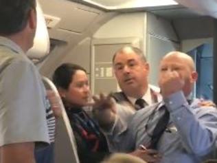 American Airlines employee "removed from duty" after trying to fight a passenger.