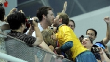 Mitcham embraces Lachlan Fletcher after winning gold in Beijing.