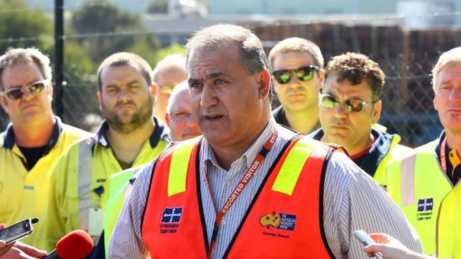 Victorian state secretary of the AWU, Cesar Melhem stands with BlueScope Steel workers in Hastings which today announced 200 job cuts.