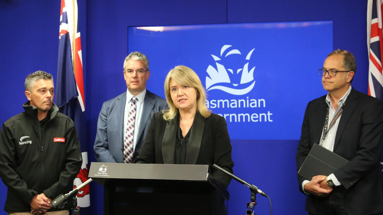 Tasracing CEO Andrew Jenkins and Tasracing Chair Gene Phair Racing Minister Madeleine Ogilvie and Department of Natural Resources and Environment acting secretary Jason Jacobi speak to the media in Hobart on Monday, March 27, 2023.