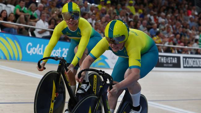 Australia's Kaarle Mcculloch (L) and teammate Stephanie Morton compete to win gold in the women's team sprint finals track cycling event during the 2018 Gold Coast Commonwealth Games at the Anna Meares Velodrome in Brisbane on April 5, 2018.  / AFP PHOTO / Patrick HAMILTON