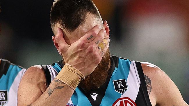 ADELAIDE, AUSTRALIA - SEPTEMBER 11: Peter Ladhams and Charlie Dixon of the Power look dejected after losing the AFL Second Preliminary Final match between Port Adelaide Power and Western Bulldogs at Adelaide Oval on September 11, 2021 in Adelaide, Australia. (Photo by Daniel Kalisz/Getty Images)