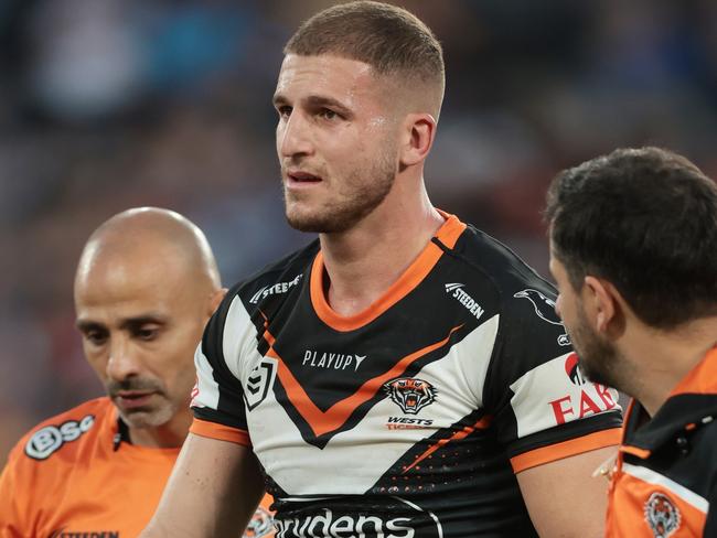 SYDNEY, AUSTRALIA - APRIL 10:  Adam Doueihi of the Wests Tigers walks from the field injured during the round six NRL match between Wests Tigers and Parramatta Eels at Accor Stadium on April 10, 2023 in Sydney, Australia. (Photo by Mark Metcalfe/Getty Images)