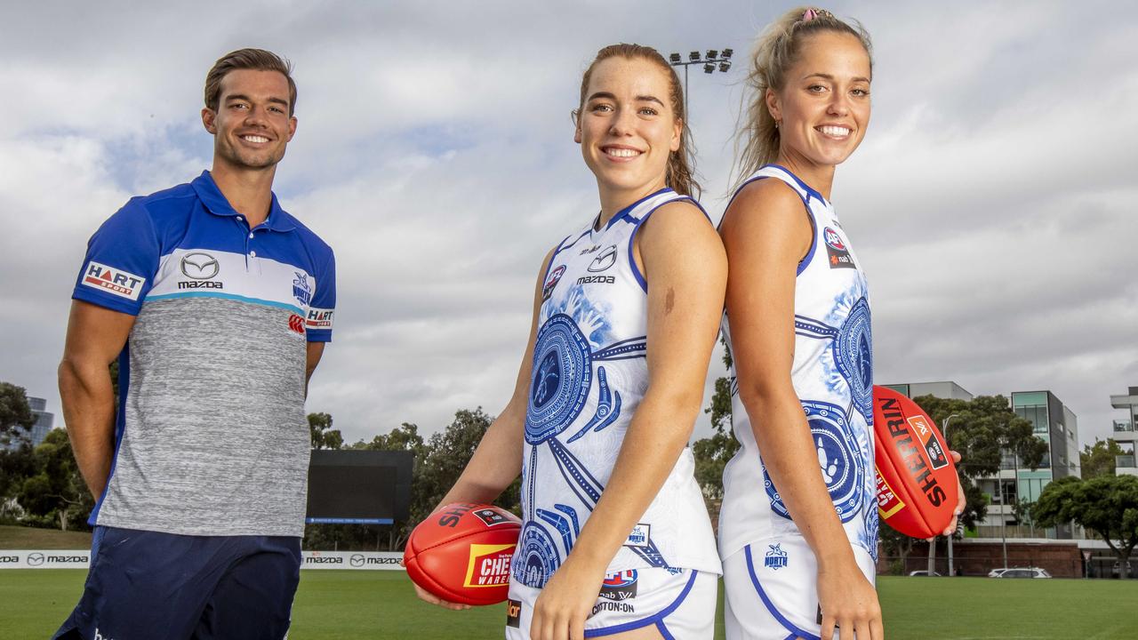 Indigenous Roos Jy Simpkin, Mia King and Kaitlyn Ashmore helped design the club’s Indigenous guernsey. Picture: Tim Carrafa