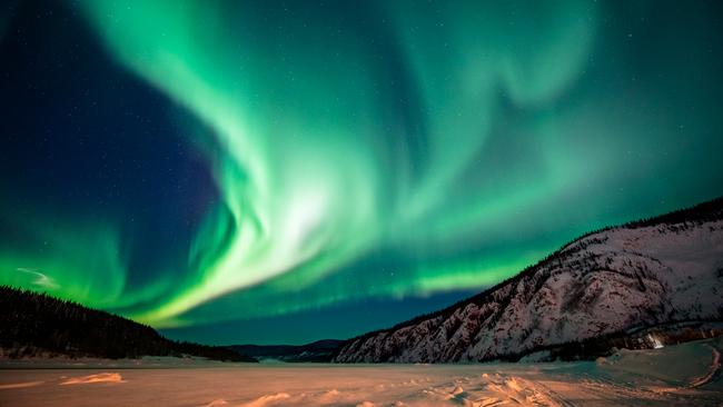 Travel + Leisure recommends the Yukon for a spot of aurora-chasing.