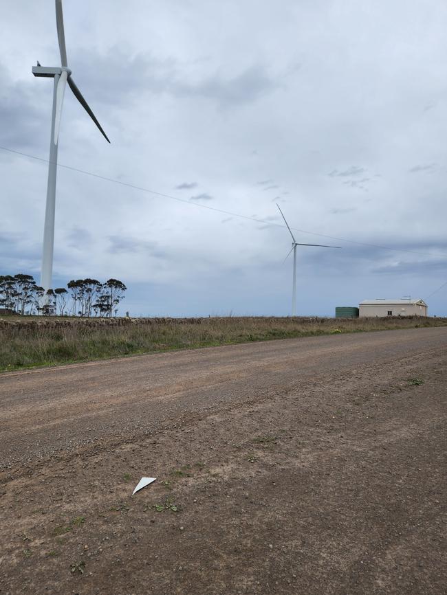 A smaller piece of turbine blade on the road.