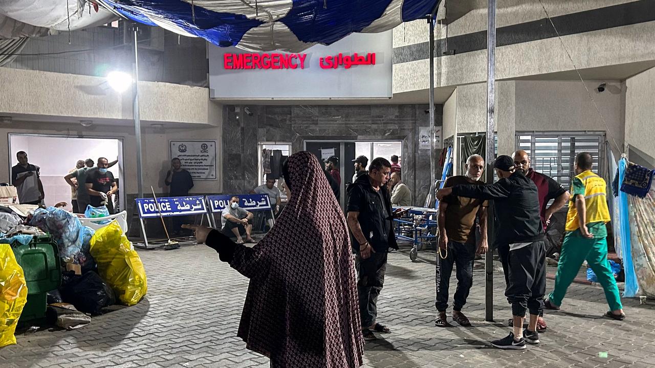 People stand outside the emergency ward of Al-Shifa hospital in Gaza City. Picture: AFP