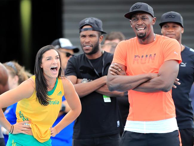 Michelle Jenneke with Usain Bolt at the Nitro Athletics meet in Melbourne last month.