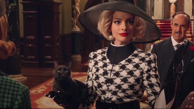 Anne Hathaway starts out looking like her normal glamorous self.