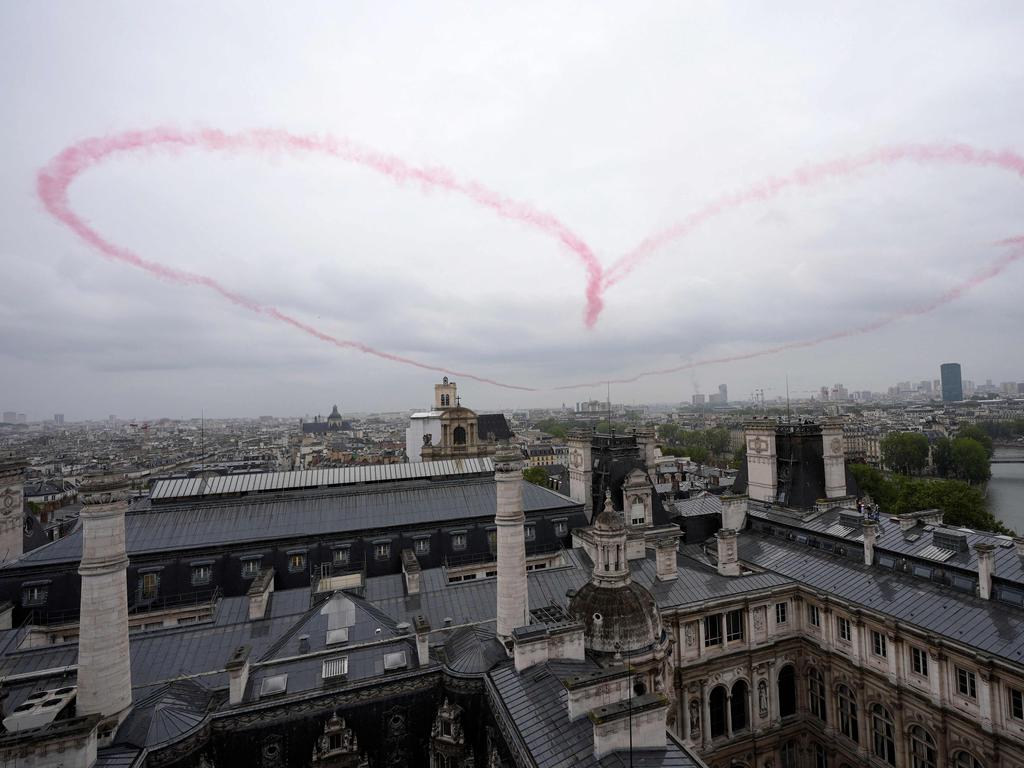 A heart is seen during the opening ceremony of the Paris 2024 Olympic Games in Paris on July 26, 2024. (Photo by Eugene Hoshiko / POOL / AFP)